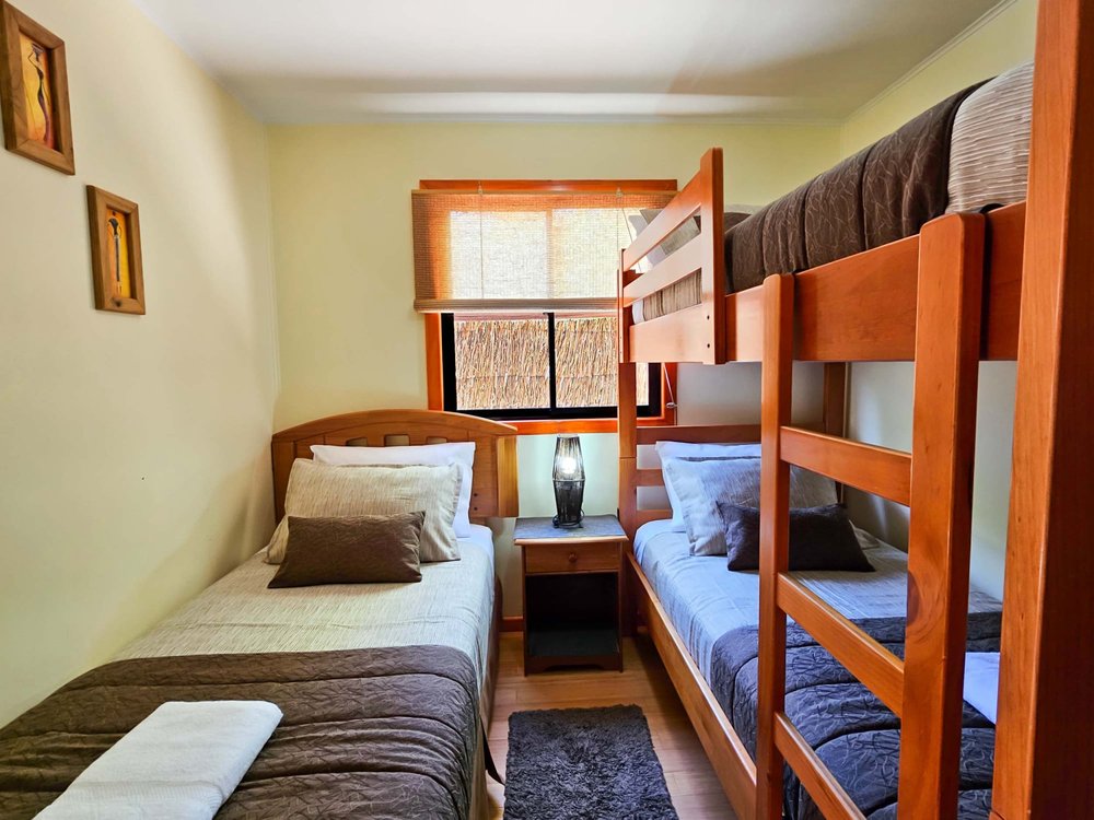 Bunk bed bedroom of the Elite Bungalow with garden view