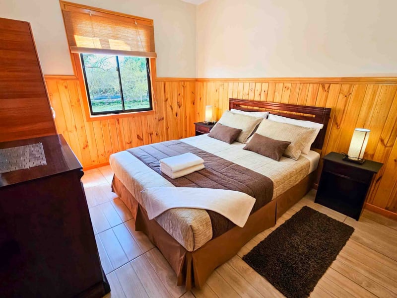 Main bedroom of the Superior Bungalow with pool view