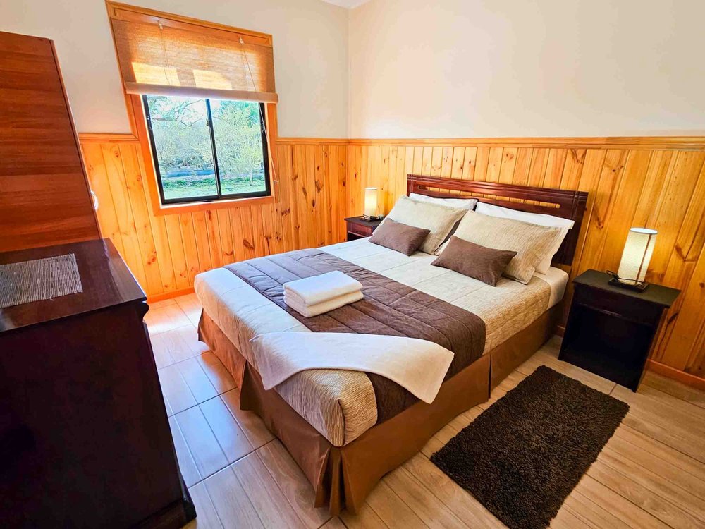 Main bedroom of the Superior Bungalow with pool view