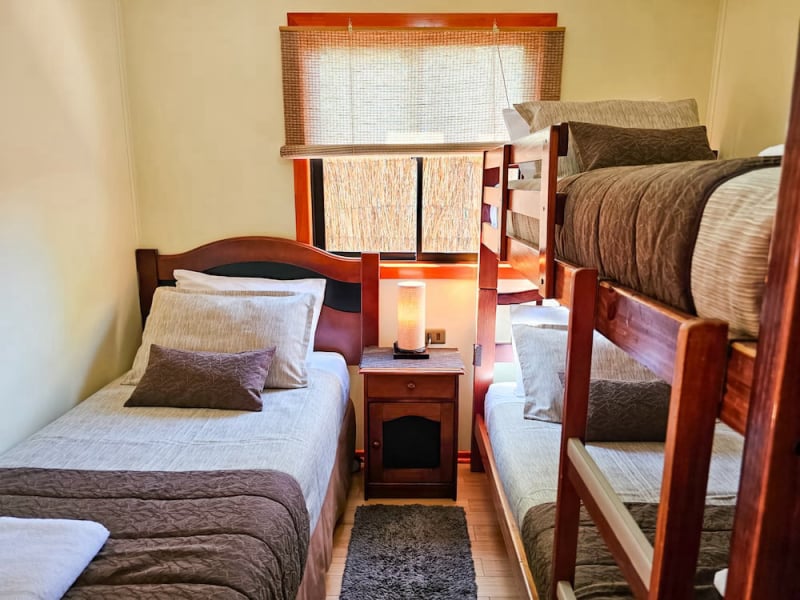 Bedroom with single bed and bunk bed