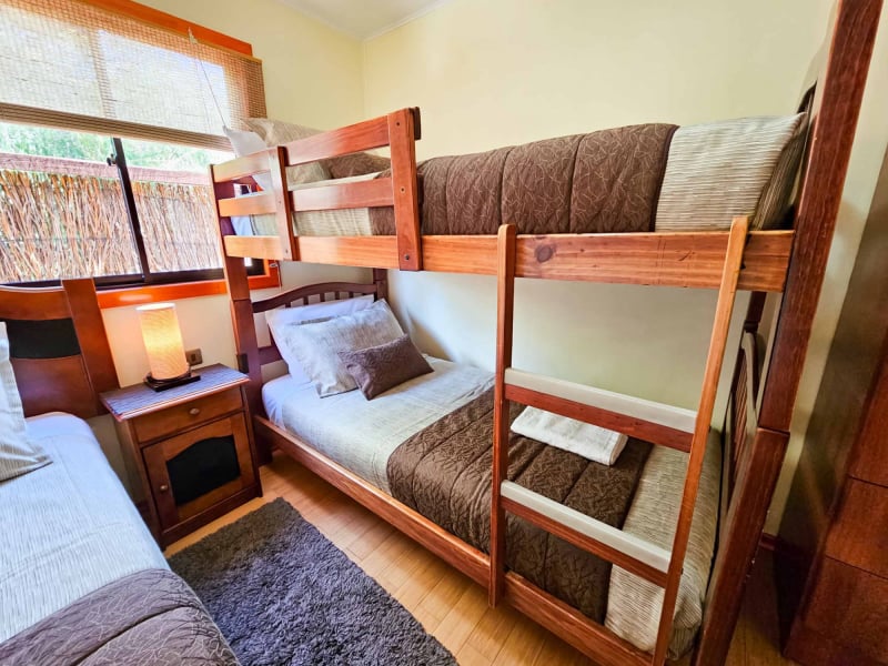 Bunk bed bedroom of the Elite Bungalow with pool view
