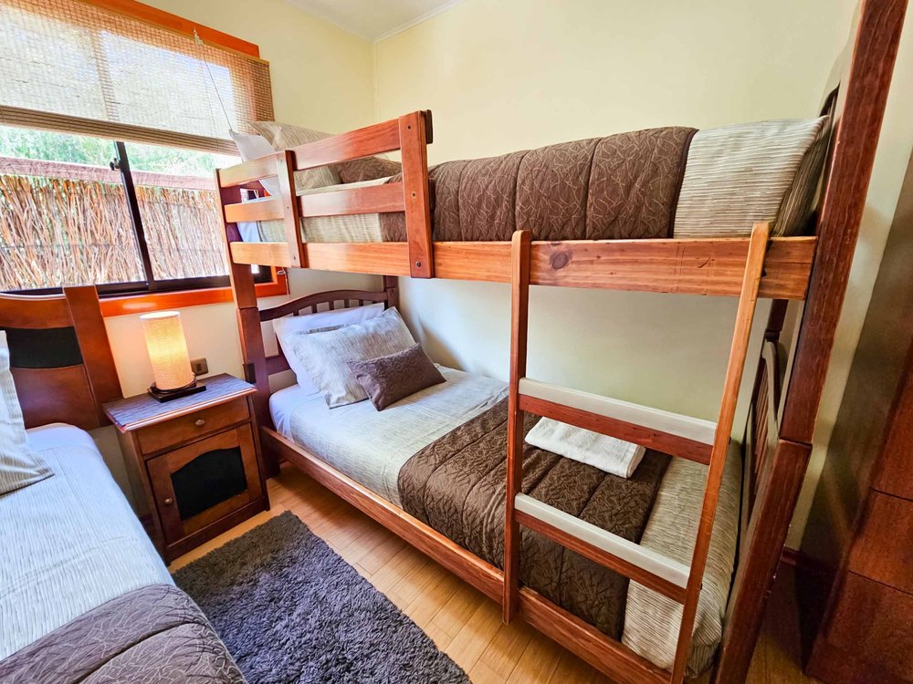 Bunk bed bedroom of the Elite Bungalow with pool view