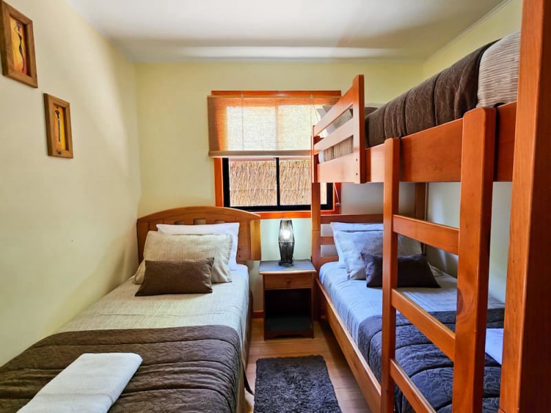 Bedroom with single bed and bunk bed