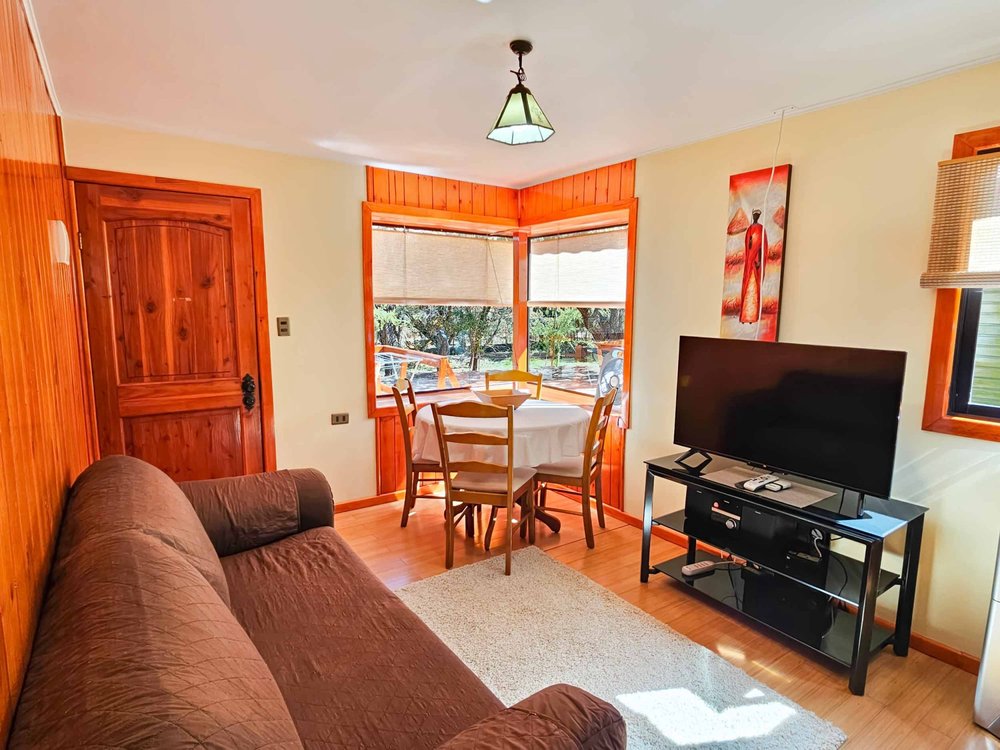 Dining area and front door of the Elite Bungalow with garden view