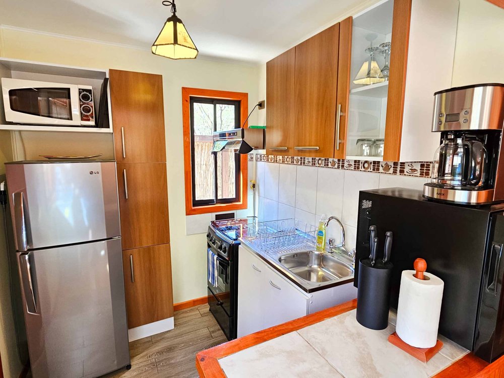 Equipped kitchen of the Elite Bungalow with garden view