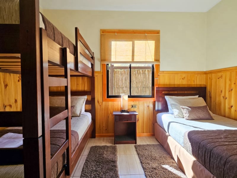 Bedroom with single bed and bunk bed