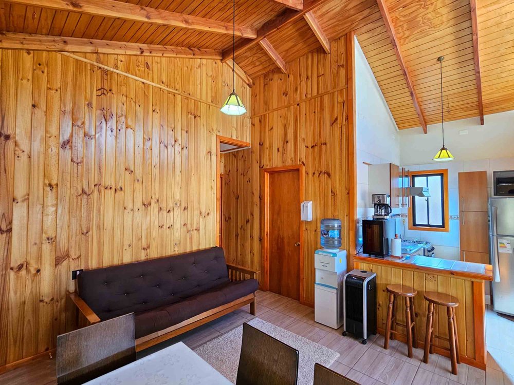 Living room and kitchen of the Superior Bungalow with pool view