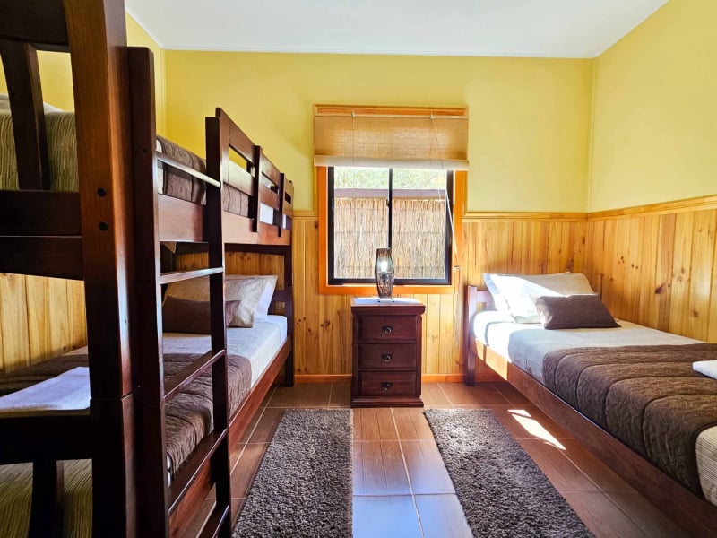 Bunk bed bedroom of the Superior Bungalow with garden view