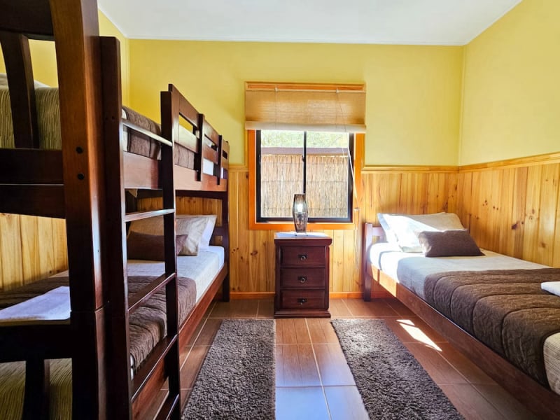 Bedroom with single bed and bunk bed