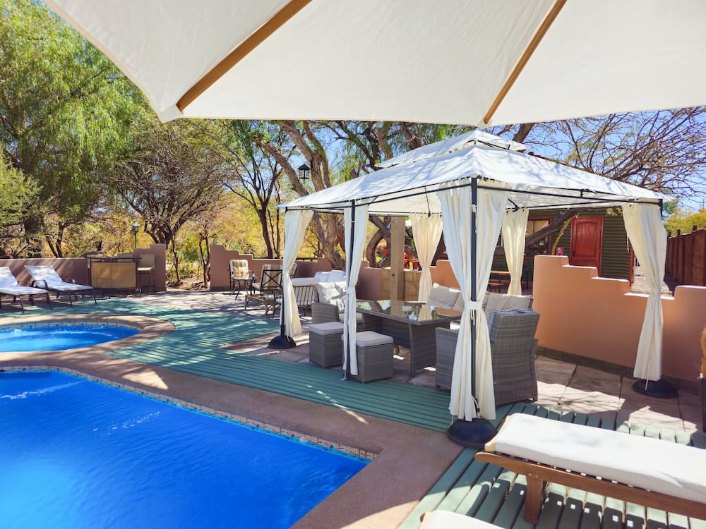 Curtained awning by the pool