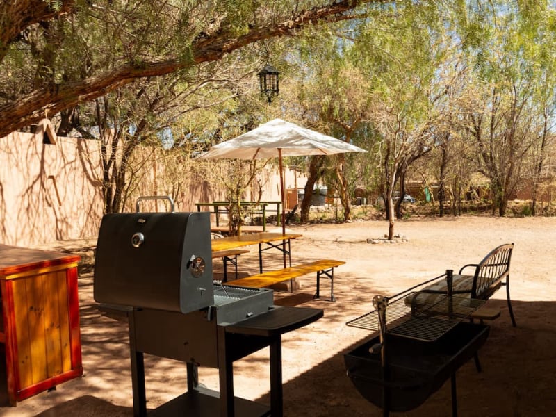 Grill and tables in the shade