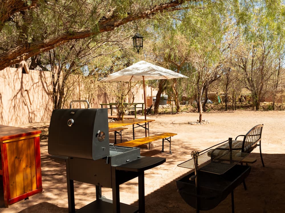 Grill and tables in the shade