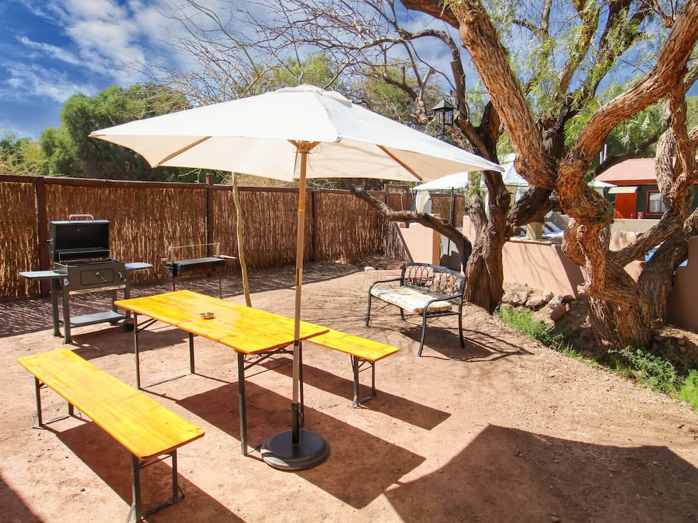 Table and grill by the fence