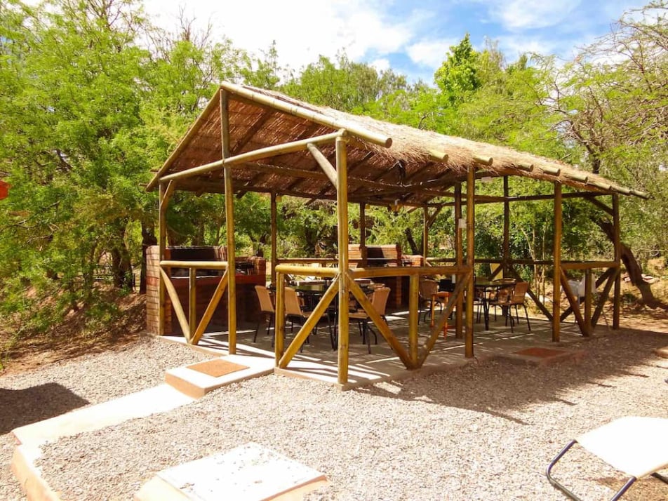 Thatched-roof BBQ area at Lodge Ancar Atacama, San Pedro de Atacama