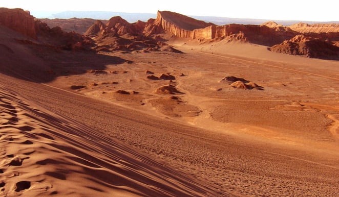 Dunes and reddish hills of Valle de la Luna (Moon Valley)