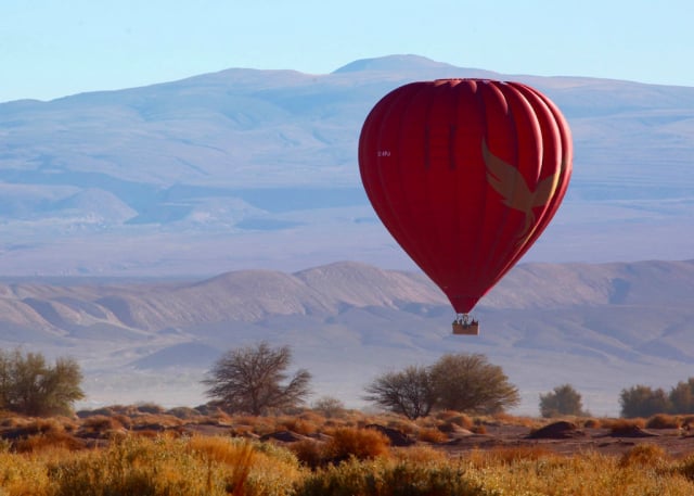 Red hot-air balloon over the Atacama Desert